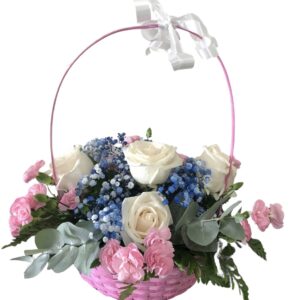 Flowers arrangement in a pink basket